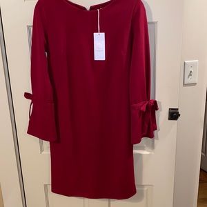 vanessa  zani red dress with bow detail at sleeve size medium